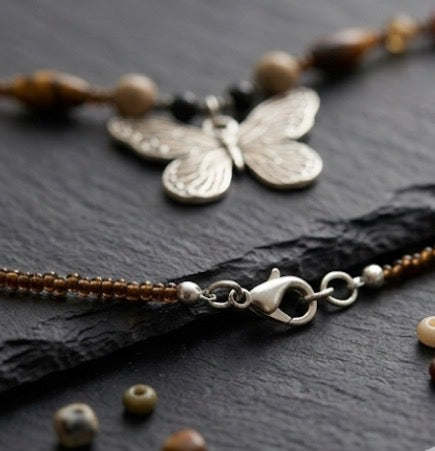 Butterfly pendant with metal chain necklace