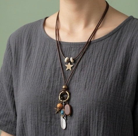 Feather pendant with leather chain necklace